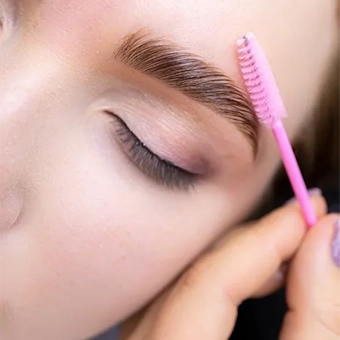 Woman doing eyebrows