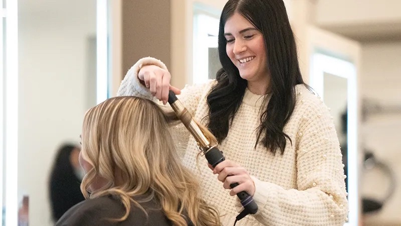 Stylist with customer