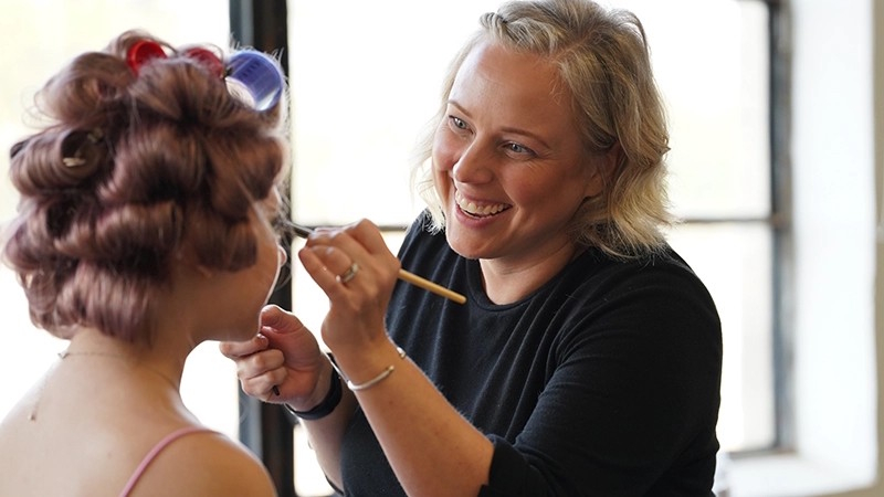 Image of client getting makeup services